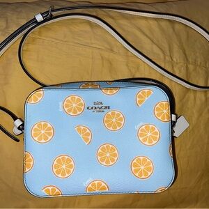 Coach orange print mini camera bag